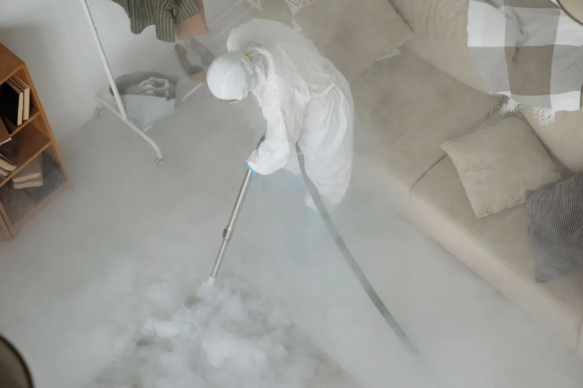 Biohazard cleanup technician in protective equipment, Tri-City, OR